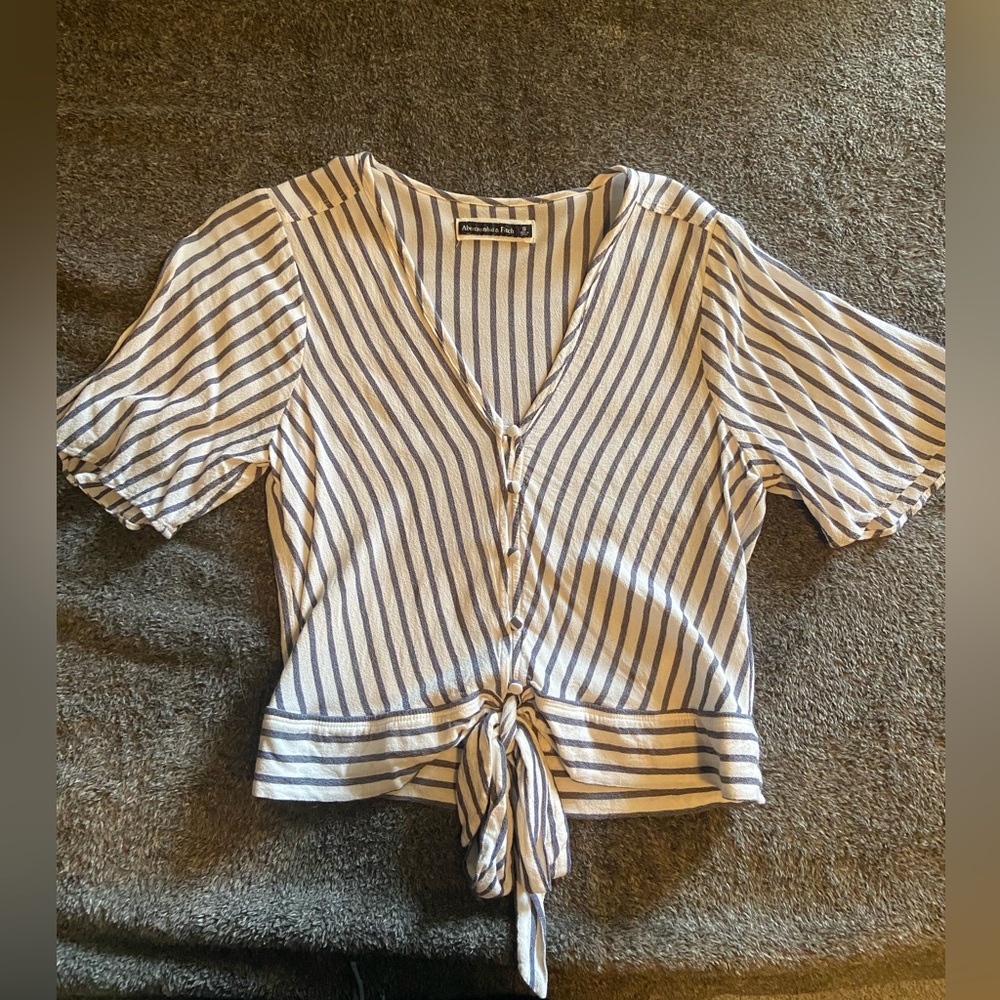 Striped blouse. Button and waist tie detailing. Lightly worn. Size medium